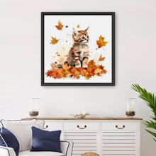 Kitten Among Autumn Leaves